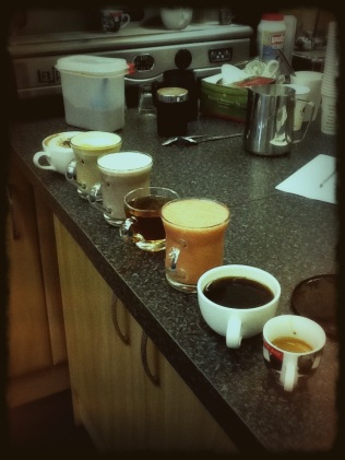 A series of completed espresso drinks as part of the qualification process